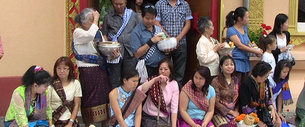 Laotian prepare donations of food and necessities for the Monks.
