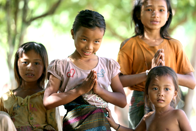 Laotian people say “Sabaidee” and bow with clasped hands in front of chest
