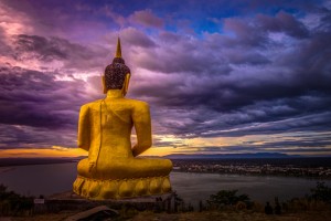 Giant golden Buddha image face the river and the town, Pakse