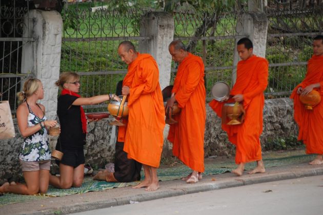morning alms giving laos main religion