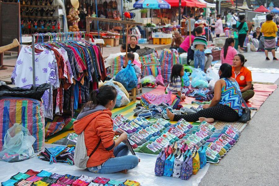 Buying souvenir in Laos - Laos tour packages