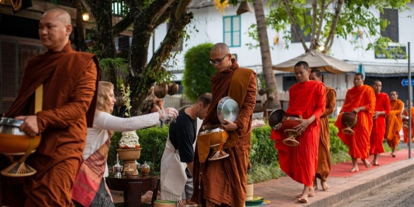 alms giving in laos tour packages